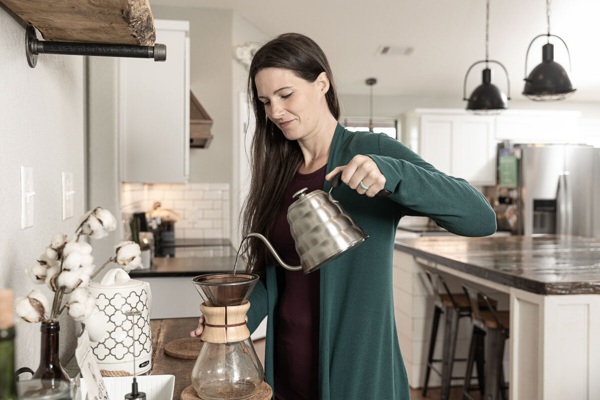 Kate Matthews pouring coffee in her kitchen